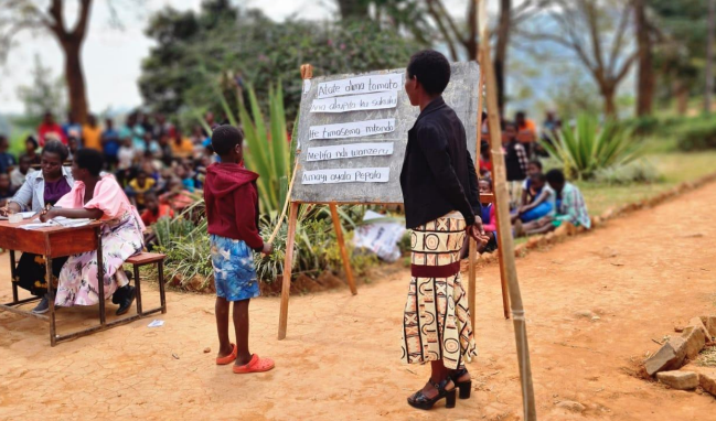 A child takes part in a spelling bee in Malawi as part of literacy project by Temwa